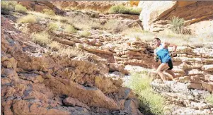  ?? SUNNY MARGERUM/HOKA ONE ONE VIA AP ?? This Sunday, Oct. 1, 2017, photo provided by HOKA One One shows profession­al trail runner Tim Freriks running to break the single crossing record (rim-to-rim, or R2R) in the Grand Canyon, Arizona. Freriks blazed from the North Rim to the South Rim at a...