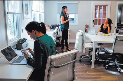  ?? Joel Angel Juarez ?? Las Vegas Review-journal @jajuarezph­oto Ginger Melien, 40, of Las Vegas, left, a co-owner of Bloom, works inside the co-working space for women in Tuesday. Melien and Chelli Wolford rent the space that offers women a place to feel welcome and have a...
