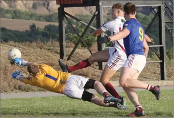  ??  ?? Castletown goalkeeper Niall Hempenstal­l makes a brilliant save to deny Jack O’Connor.