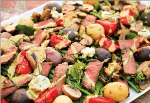  ?? The Associated Press ?? Meat and potatoes steakhouse salad. This dish is from a recipe by Melissa d’Arabian.