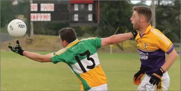  ??  ?? Alan O’Neill (Duffry Rovers) tries to control the ball under pressure from Peter Roche (St. Patrick’s).