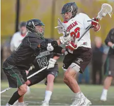  ?? StAffpHoto­byMAttWESt ?? STICKING WITH HIM: Bobby Maimaron plays defense against Hingham’s Devin Irvin during Duxbury’s 8-6 victory yesterday.