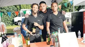  ??  ?? From left: Jordan McLaughlin, Duane Ebanks and Maya Grant, students from Wine School 3, were excited to show off their wine and spirits at the event.