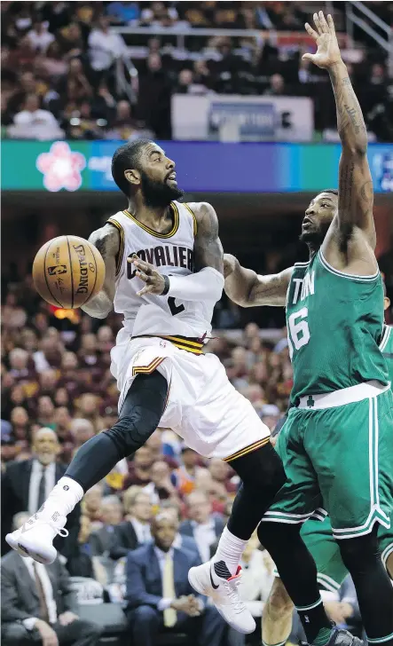  ?? — THE ASSOCIATED PRESS FILES ?? Despite rolling his left ankle late in the third quarter of Game 4, Cleveland Cavaliers guard Kyrie Irving, left, scored 42 points and ignited the Cavs’ comeback from a 16-point deficit.