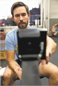  ??  ?? John Petersen, principal at the Bridge Academy elementary school in Oakland, works out at a gym after returning from a rowing expedition from Chile to Antarctica that he says he will never do again.