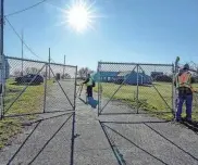  ?? ?? Providence paid off years of delinquent taxes and is no longer on the verge of losing Camp Cronin, its long-unused seaside camp in Narraganse­tt.