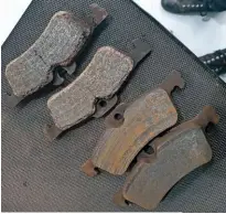  ??  ?? One set of rear brake pads had started binding, to the point where the heat had made the friction material go flaky.