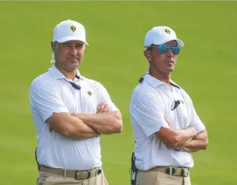  ?? JIM DEDMON/USA TODAY SPORTS ?? Internatio­nal Team captain Trevor Immelman, left, and assistant captain Mike Weir look on during the Presidents Cup at Quail Hollow Club in Charlotte, N.C.