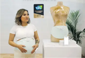  ?? JOHN LOCHER/AP ?? Owlet’s new US$299 pregnancy band tracks fetal heartbeats by taking an electrocar­diogram. It is meant for women to use before going to sleep about three to four months before the due date.