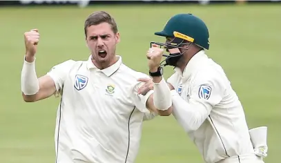  ?? Picture: AFP ?? BIG WICKET. Proteas speedster Anrich Nortje (left) celebrates after the dismissal of England captain Joe Root during the fourth day of the first Test in Centurion yesterday.