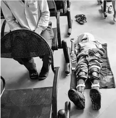  ??  ?? Photograph shows a disabled Indian boy sleeps at the Bhagwan Mahaveer Viklang Sahayata Samiti non-profit organisati­on’s main branch in Jaipur. — AFP photo