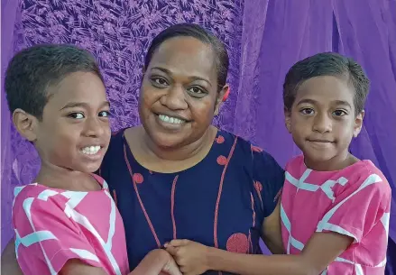  ?? Photo: Wati Talebula-Nuku ?? Lusiana Ratu with her twin daughters Kelera Olivia Tiko Faith (left) and Kalara Litiana Grace (right) during the Internatio­nal Lupus Day in Suva on May 10, 2023.