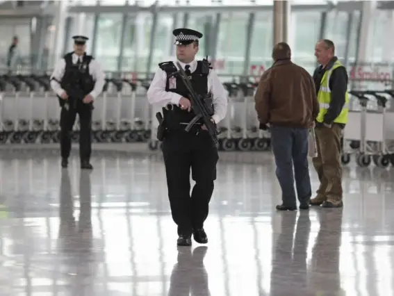  ??  ?? Officers patrol Heathrow. Currently there is considerab­le sharing of informatio­n between police forces across the EU (AFP/Getty)