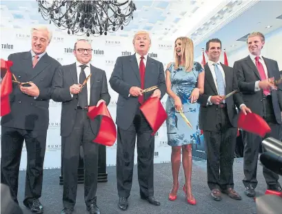  ?? CNW GROUP TRUMP INTERNATIO­NAL ?? Donald Trump and members of his family attend the opening of the Toronto Trump Internatio­nal Hotel &amp; Tower in April 2012.
