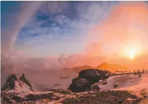  ?? PHOTO: REUTERS/KCNA ?? A view of the dawn from the summit of Mt Paektu.