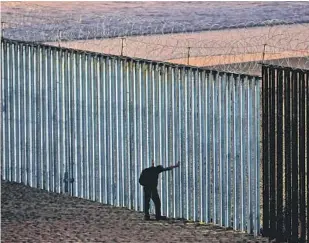  ?? Gary Coronado Los Angeles Times ?? THE BORDER WALL on the beach in Tijuana is topped with concertina wire to prevent attempted crossings. The U.S. has detained a record number of migrants in recent months.