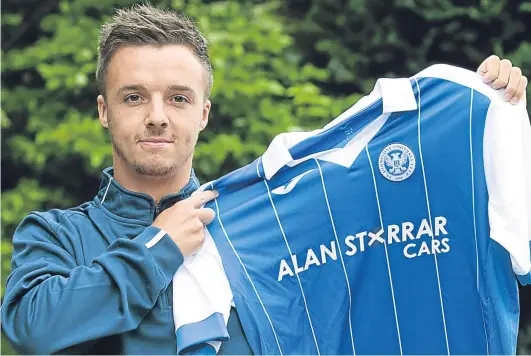  ?? Perthshire Picture Agency. ?? Stefan Scougall shows his new colours at St Johnstone’s training camp in Largs yesterday after signing a two-year deal with the Saints, who will today find out their opponents in the first round of the Europa League qualifiers.