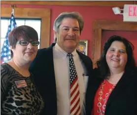  ??  ?? Floyd County Republican Party Chairman Layla Shipman (from left) welcomes Floyd County Coroner Barry Henderson and FloydSarah Lane / Rome News-Tribune County District Attorney Leigh Patterson to the Republican Party at the organizati­on’s meeting Saturday morning.