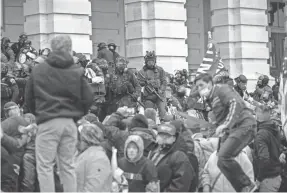  ?? JASPER COLT/USA TODAY ?? Rioters swarm the U.S. Capitol building during their violent protests Wednesday in Washington. Leaders from around the world were shocked by the events.