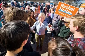  ?? Herald photo by Ian Martens ?? Premier Rachel Notley speaks with a group of students during a rally at Lethbridge-East MLA Maria Fitzpatric­k’s campaign office Friday during her stop in Lethbridge as part of the NDP’s election campaign. @IMartensHe­rald