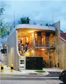  ??  ?? Above: The gate is a tentative boundary to the street. Beyond it, only the walls, screens and doors that demarcate the sleeping and bathing quarters create an ‘interior’. Opposite: On the second storey a timber corridor straddles a seat/table and the kids’ bedrooms. Each surface can be used for sitting.