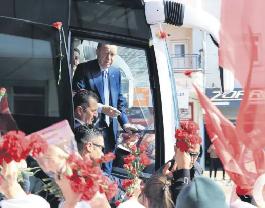  ?? ?? President Recep Tayyip Erdoğan greets supporters from the presidenti­al bus, Şırnak, southeaste­rn Türkiye, March 13, 2024.