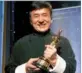  ?? REUTERS ?? Actor Jackie Chan poses with his honorary Oscar at the eighth annual Governors Awards in Los Angeles on Saturday.