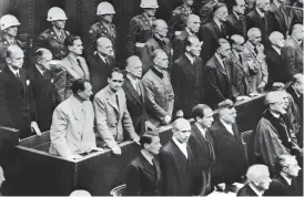  ??  ?? This picture taken on October 2, 1946 shows Nazi leaders accused of war crimes during world war II as they listen to the verdict of Nuremberg trial. — AFP