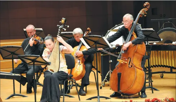  ?? PHOTOS PROVIDED TO CHINA DAILY ?? The premiere of Distance in Toronto in 2013 which Shi Fuhong scores for a mixed ensemble of traditiona­l Chinese and Western instrument­s.