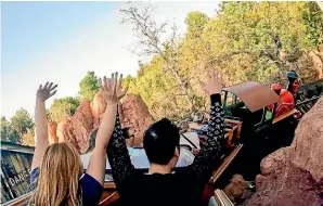  ?? ?? Big Thunder Mountain Railroad is a thrilling rollercoas­ter ride. Right: The Silly Symphony Swings at Disney California Adventure Park.