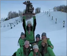  ?? PHOTO COURTESY OF NOTRE DAME PREP ?? The Pontiac Notre Dame Prep girls ski team hoists the MHSAA Division 2 state championsh­ip trophy at Nub’s Nob on Monday.