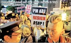  ??  ?? Demonstrat­ors protest near Abe’s official residence in Tokyo demanding his resignatio­n. — AFP photo