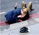  ?? Reuters ?? A woman assists an injured person after the incident. —