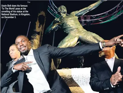  ?? FILE ?? Usain Bolt does his famous ‘To The World’ pose at the unveiling of his statue at the National Stadium, in Kingston, on December 3.