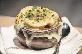  ?? CONTRIBUTE­D BY MIA YAKEL ?? The oxtail French onion soup with cave aged gruyere cheese is one of the classic dishes at The Federal.