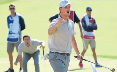  ?? Photograph: Getty ?? Thomas Pieters celebrates a birdie putt in the foursomes as Rory McIlroy looks on