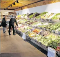  ?? REUTERS ?? Vegetables and fruits are displayed at the farm shop at the Spargelhof Rafz farm of Jucker Farm AG in Rafz, Switzerlan­d.