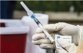  ?? PEDRO PORTAL pportal@miamiheral­d.com ?? South Florida hospitals adopted different policies to encourage employees to get vaccinated against COVID-19, with a few imposing a mandate. A new federal rule requires all healthcare workers to be vaccinated by Jan. 4.