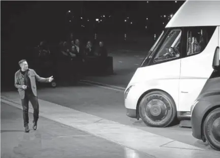  ?? Veronique Dupont, AFP/Getty Images ?? Tesla CEO Elon Musk unveils the company’s new electric semi-truck Thursday night in Hawthorne, Calif.