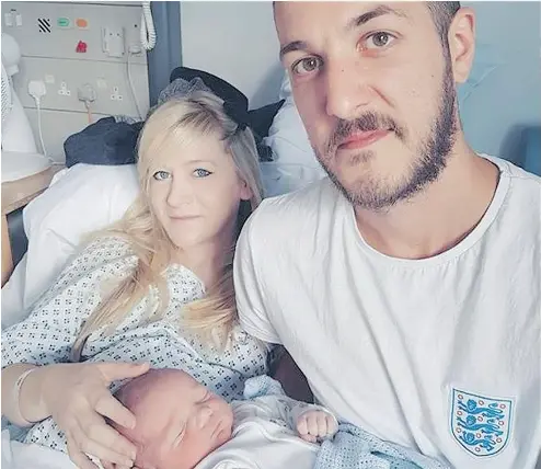  ?? FAMILY OF CHARLIE GARD VIA THE ASSOCIATED PRESS ?? Connie Yates and Chris Gard with their son Charlie Gard in an undated photo provided by the family. Despite the parents’ opposition, a European court has ruled the terminally ill infant should be taken off life support.