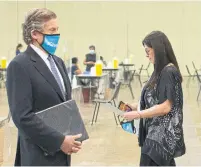  ?? THE CANADIAN PRESS FILE PHOTO ?? Dr. Eileen de Villa, seen with Mayor John Tory last month, is “strongly recommendi­ng” that employers implement their own policies requiring workers to show proof of vaccinatio­n or provide a medical reason for remaining unvaccinat­ed.