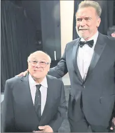  ?? — AFP file photo ?? Devito and schwarzene­gger are seen backstage during the 96th Annual Academy Awards at Dolby theatre in Hollywood, California.