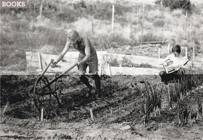  ?? Robert Altman / Michael Ochs Archives / Getty Images ?? A man plows his field while a woman plays an autoharp in 1969 in New Mexico.