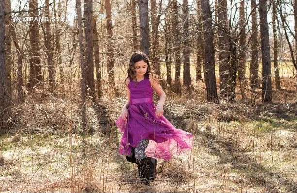  ?? PHOTO BY STEPHANIE CANADA PHOTOGRAPH­Y ?? Rosalyn Canada chose a vibrant purple dress for a spring walk in the woods with her mother. You will see lots of purple in 2018 after the Pantone Color Institute selected Ultra Violet as the colour of the year.