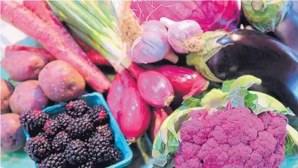  ?? DENISE MILLER/FOR THE JOURNAL ?? Purple foods are rich in nutrients and are available at farmers’ markets now.