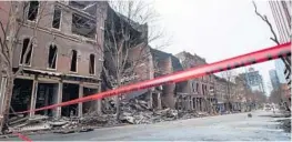  ?? ANDREW NELLES/THE TENNESSEAN ?? Officials are continuing to assess building damage caused by a Christmas Day explosion in Nashville, Tennessee on Thursday.