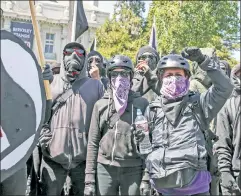  ??  ?? Masked evil: Antifa members riot in Berkeley, Calif., in August 2007.