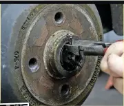 ??  ??  Some brake drums require 3 the hub nut to be undone to be able to remove them, such as this rear drum on a Vauxhall Tigra. A hubcap may be fitted, which will need to be prised off. Extract any split pins, then undo the hub nut and fully remove it.