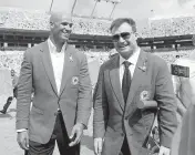  ?? JOE RIMKUS JR. Miami Herald Staff ?? Ex-Dolphins defensive end Jason Taylor and linebacker Zach Thomas after the ring of honor ceremony in 2012.