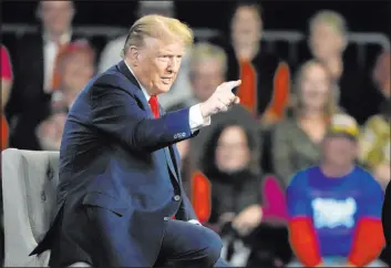  ?? Chris Carlson The Associated Press ?? Republican presidenti­al candidate former President Donald Trump spent more in January than his campaign took in, a potential warning sign as the campaign wears on.